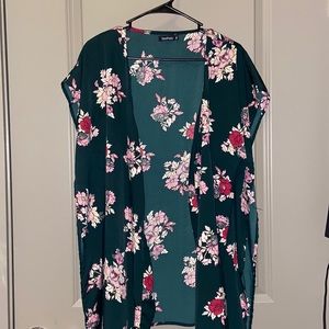 Short sleeveless green floral kimono. Great over swimsuits or with jeans!